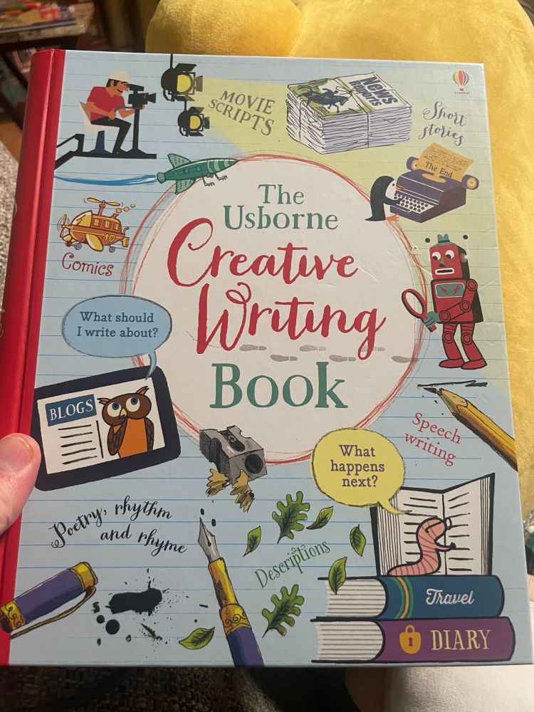 The cover of the Usborne Creative Writing book with a bookworm reading books, a pen with ink marks. An owl on a tablet screen 