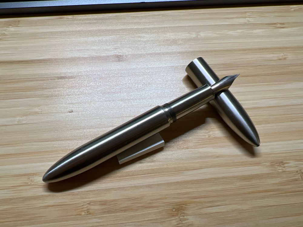 Uncapped Gravitas pen showing their new Flex nib resting on the cap