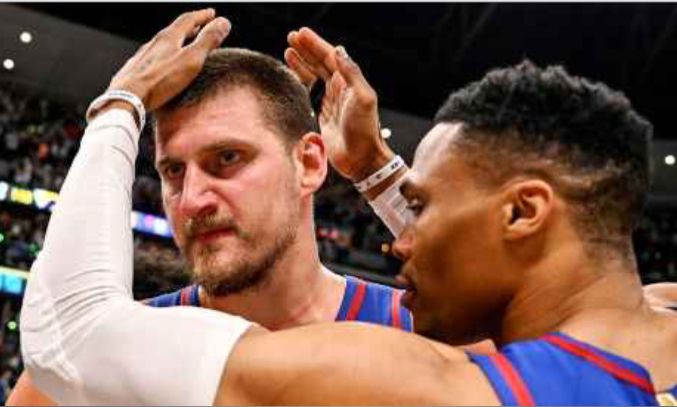 russell westbrook caresses the area around nikola jokic’s skull