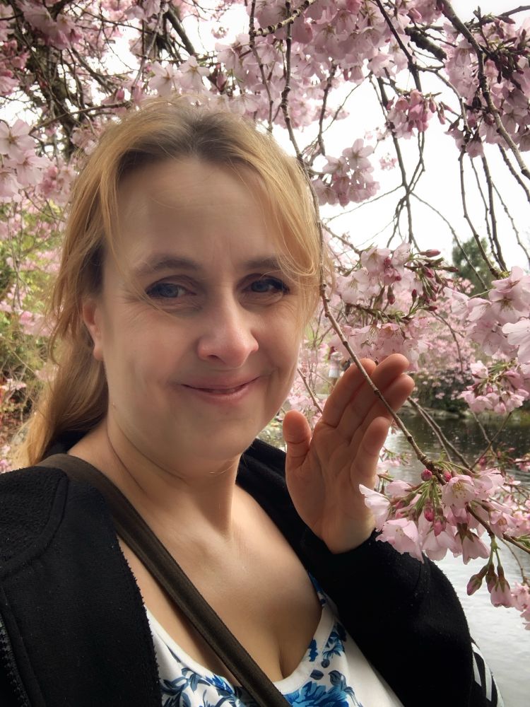 Selfie in front of cherry blossoms 