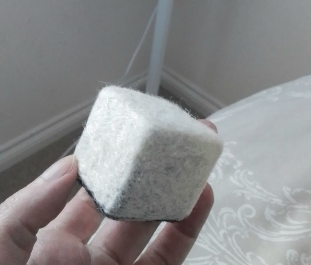 A cube made out of felted wool. These are the kind of things that prevent me from making any real progress in life.