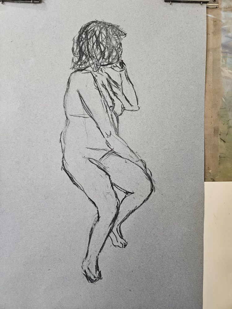 a shoddy drawing of a woman sitting and looking to the side, her head is being propped onto her hand and one hand crosses over her lap. She's sitting on a chair but it was not drawn in in time. This one had not been shaded yet and I keep it in cause I kind of like it like this way as well. Overall form was draw with charcoal vine pencil.