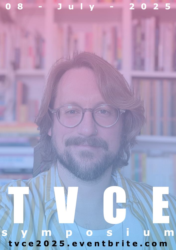 A portrait photograph of Thomas Jeram-West. Thomas is a White Northern European non-binary person, with shoulder-length layered brown hair and a full beard. They wear glasses with clear frames and their nose is pierced on the left side with a small silver ring. They are half smiling at the camera as they look directly into it. They are wearing a white and yellow striped shirt open to show a white t-shirt underneath, and a thin silver chain around their neck. They are in front of a set of bookshelves, blurred in the photograph. The photograph has an overlay: a gradient moving down, from pink to blue, bearing the following text: 08 - July - 2025, TVCE Symposium, tvce2025@eventbrite.com.