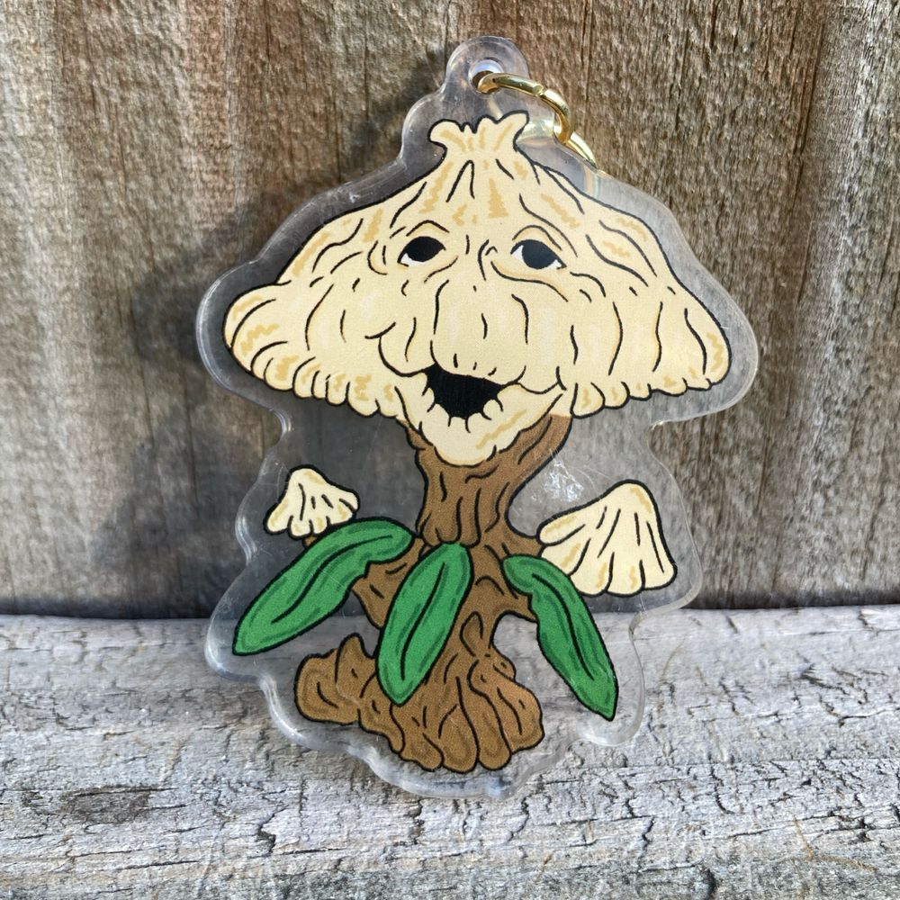 Acrylic keychain from Dylantiquities featuring Orbadon, a character from the E.T. Ride at Universal Studios.