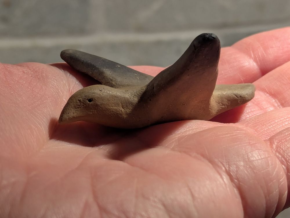 Small ceramic raven figurine