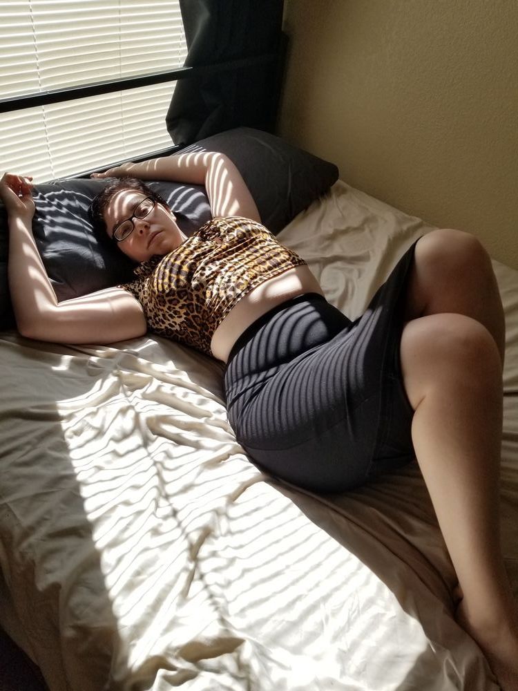 Jane laying in the sun on the bed