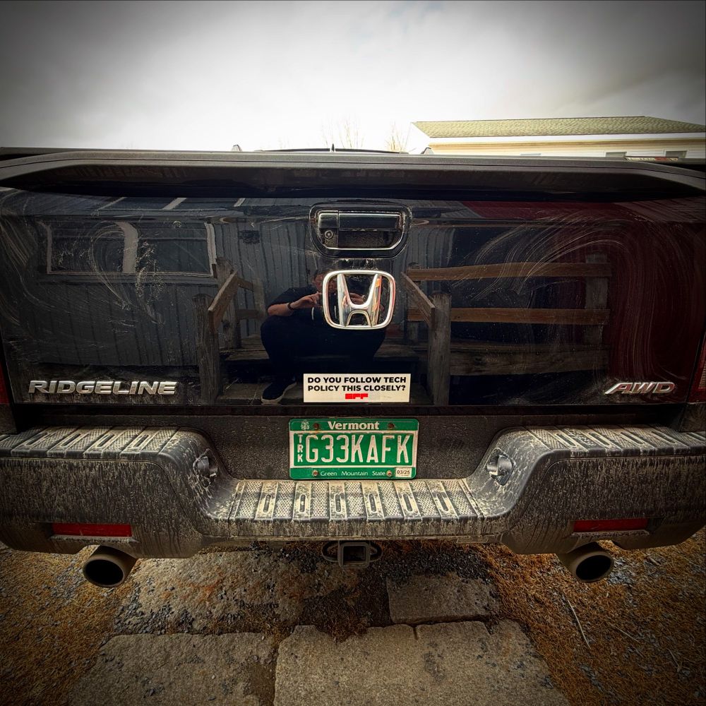 Truck with “Do you follow tech policy this closely?” sticker.