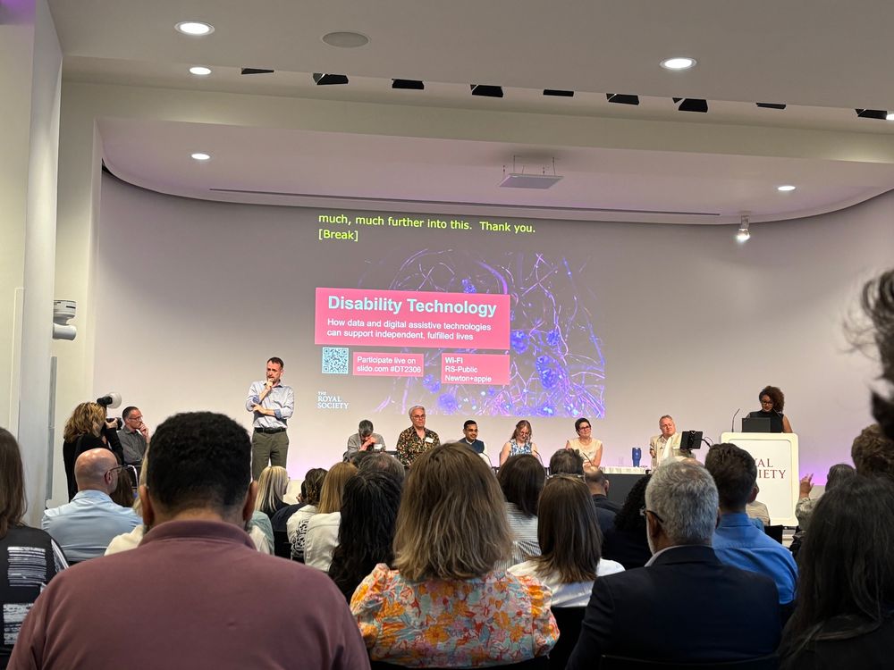 Image of an expert panel at a Royal Society event to discuss their new report on disability technology. A screen behind them shows the title and subtitle of the report.