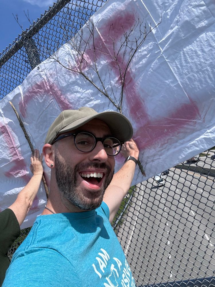 Me, helping support a sign