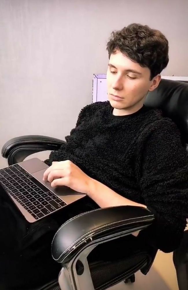 gorgeous man is typing on his keyboard 