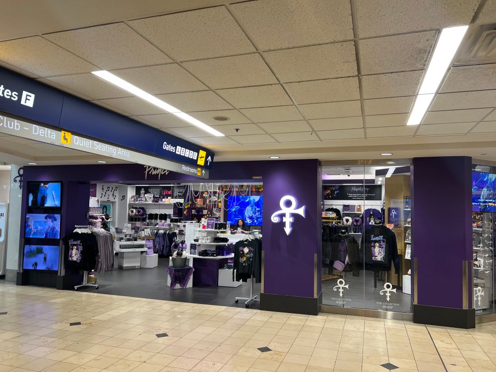 Front of the Prince store at the Minneapolis airport, all purple, with his symbol as a glowing sign