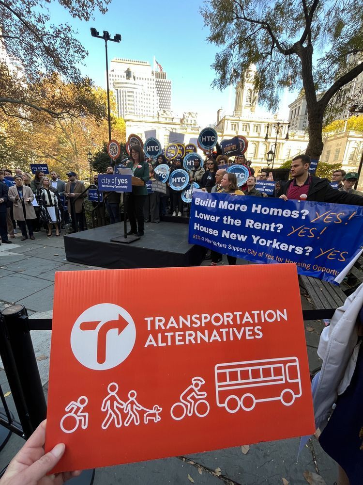 A Transportation Alternatives sign at a rally for the City of Yes