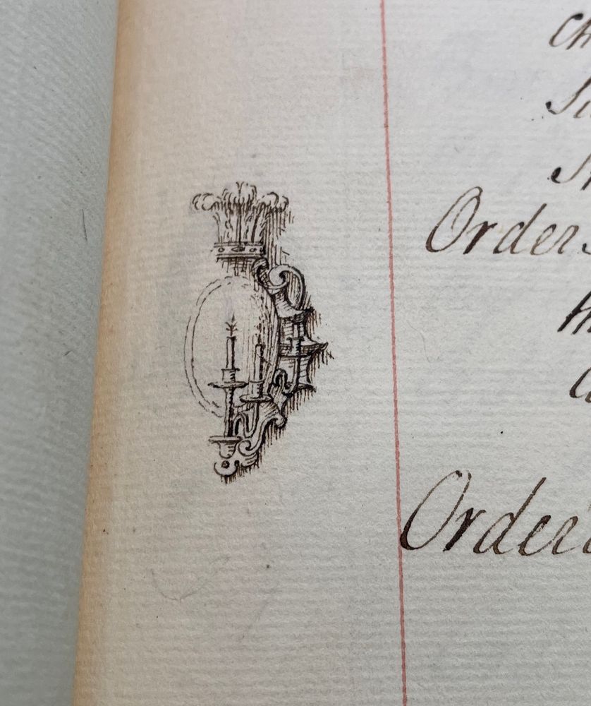 Sketch of a shield design with candles on the right side and feathers at top