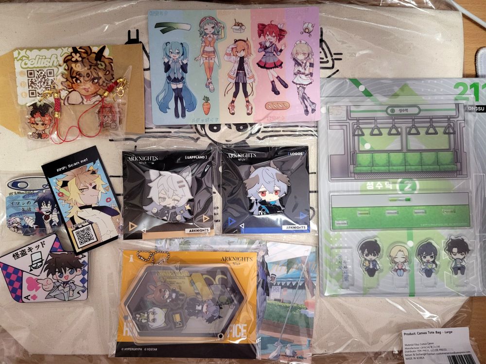 merch from AX (sorry i forgot to get the business card for the vocaloid stickers but i bought them from sxilin)