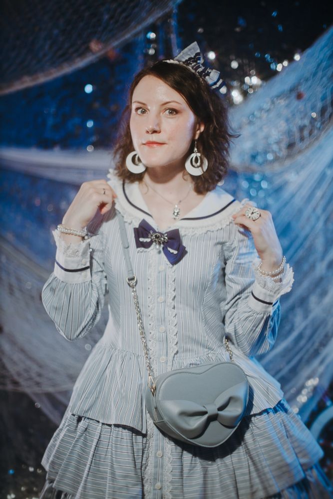 A picture of a girl in sailor lolita outfit in marine-themed photo zone