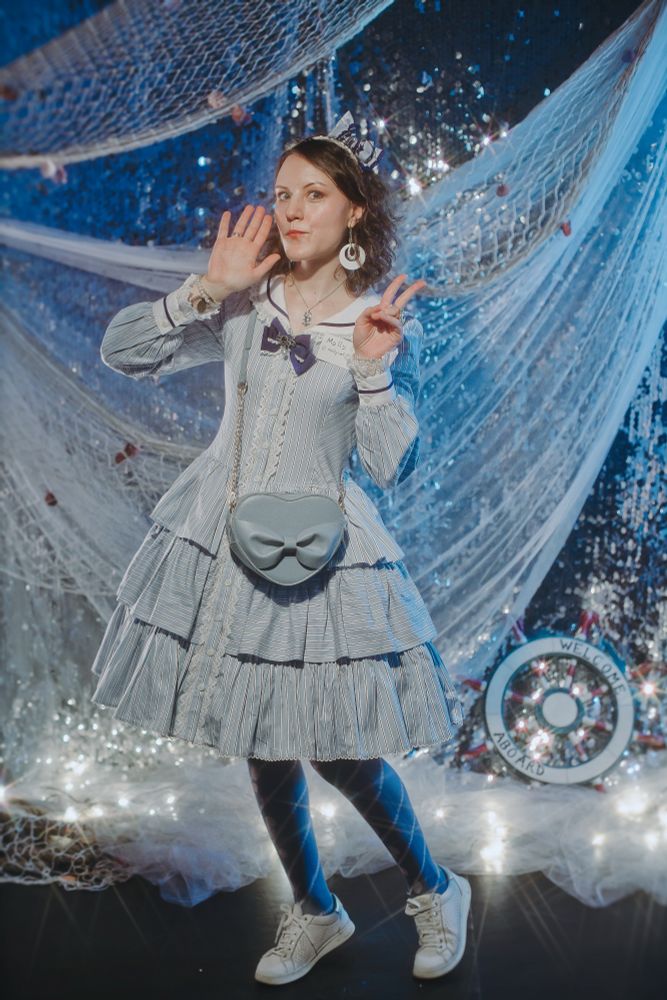 A picture of a girl in sailor lolita outfit in marine-themed photo zone