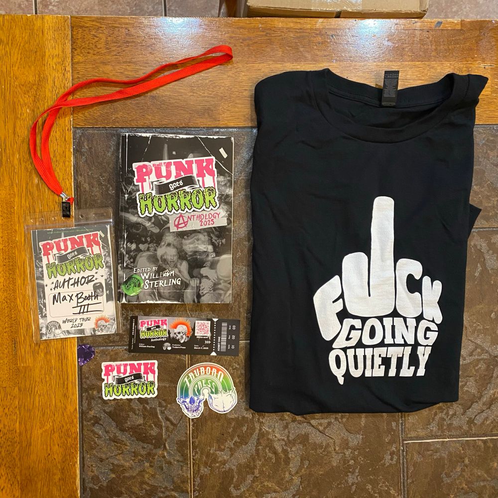 Contributor copy of Punk Goes Horror along with a bunch of merch. Lanyard with my name on it. Stickers. Book mark. Guitar pick. T shirt (front side says FUCK GOING QUIETLY)