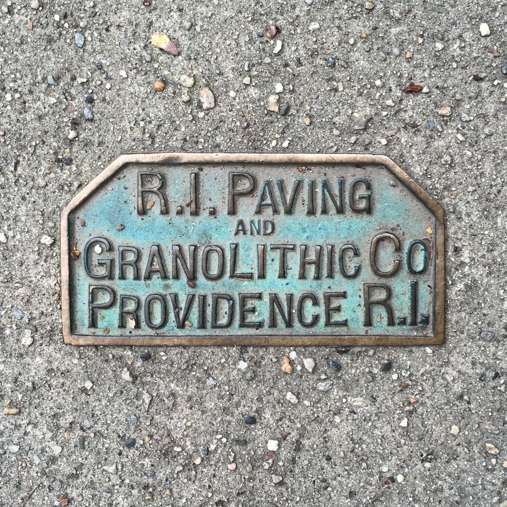 brass marker set in concrete: R.I. Paving and Granolithic Co, Providence R.I.
