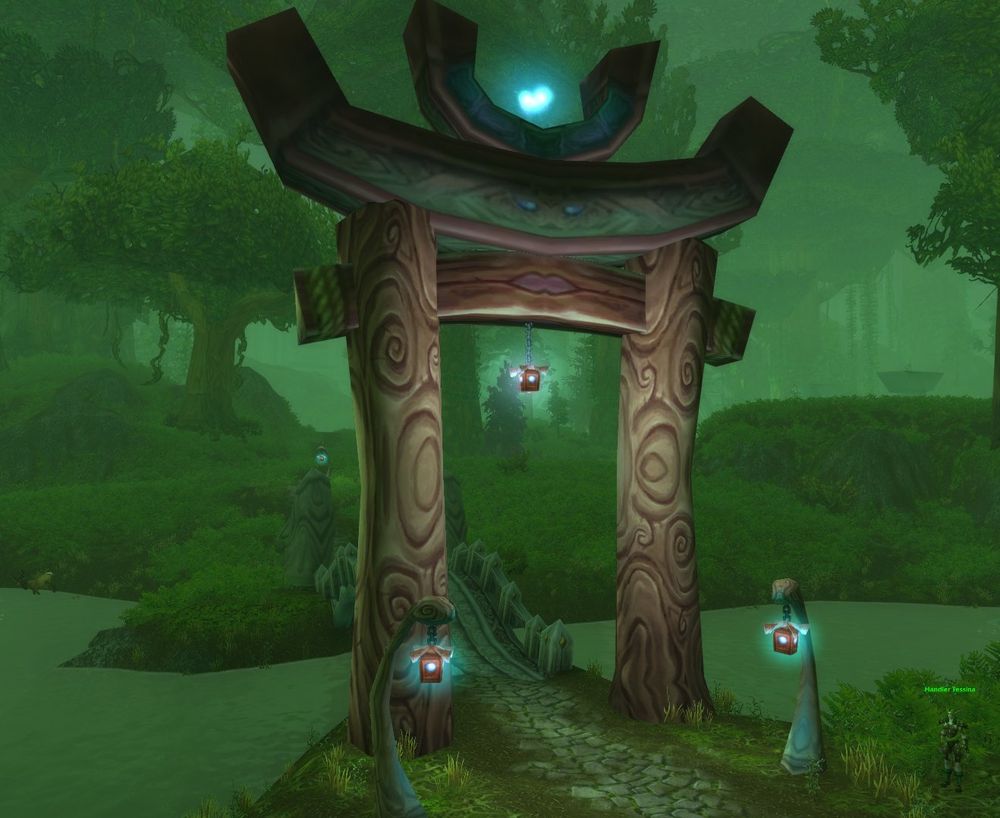 A kaldorei torii with a lantern hanging from the center in Feralas