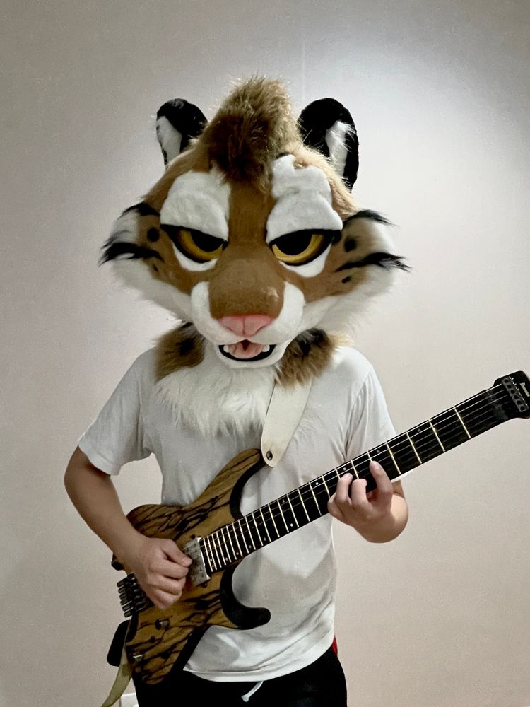 Leucean holding a Ibanez Q52 guitar