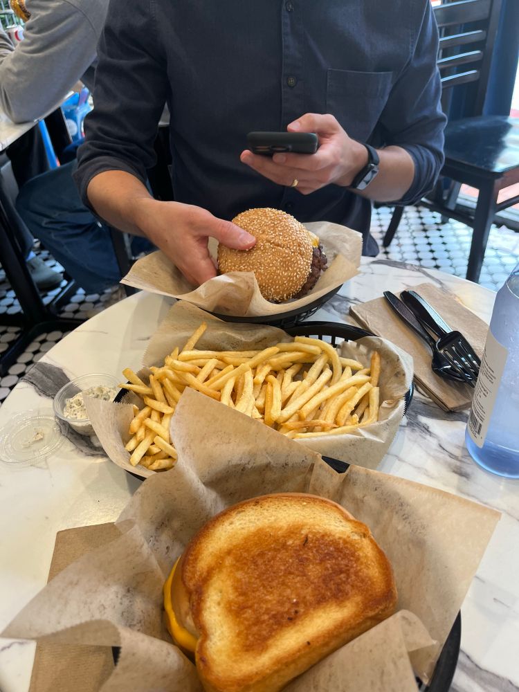 Burger, fries, and a tuna melt 
