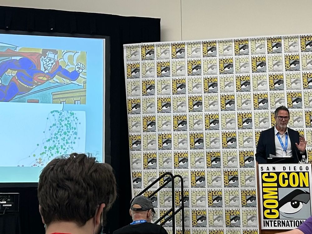 Me at a podium giving a talk about Bizarro at comic-con 