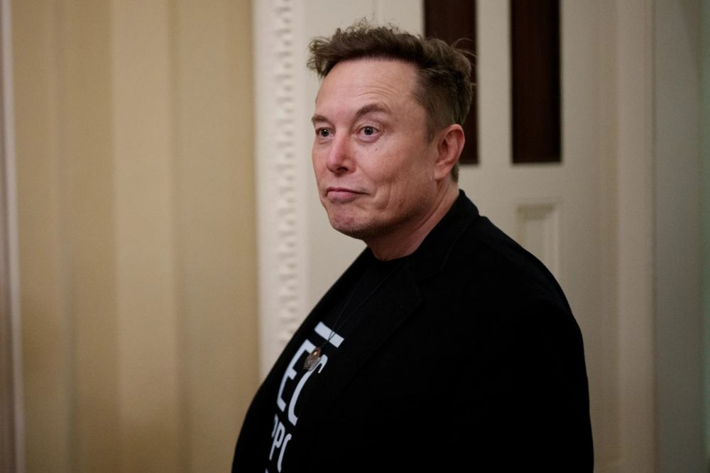A picture of Elon Musk looking like the old out-of-shape lunkhead he is.