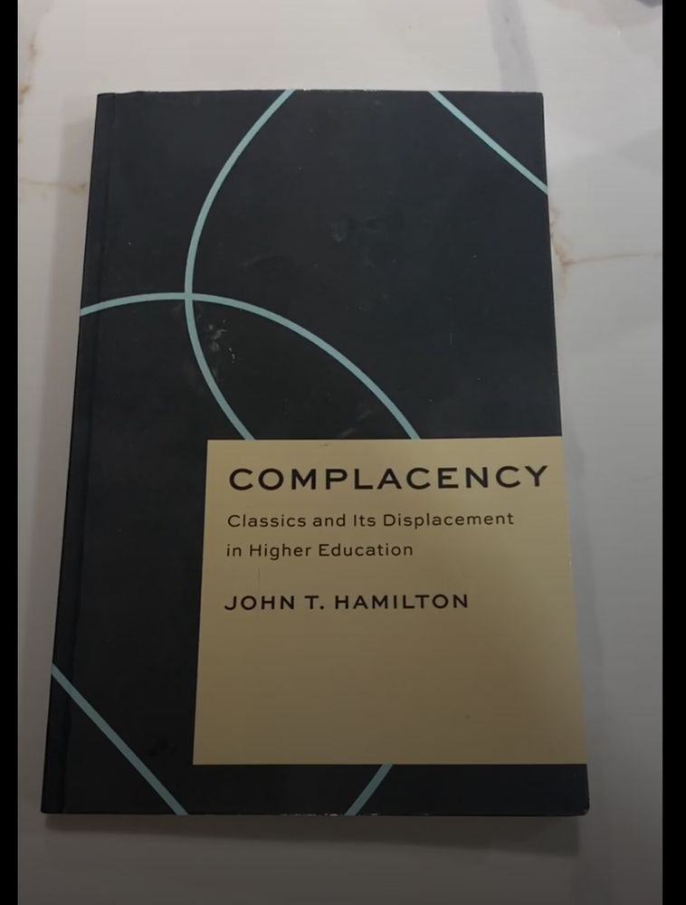 The cover of Complacency by John T Hamilton