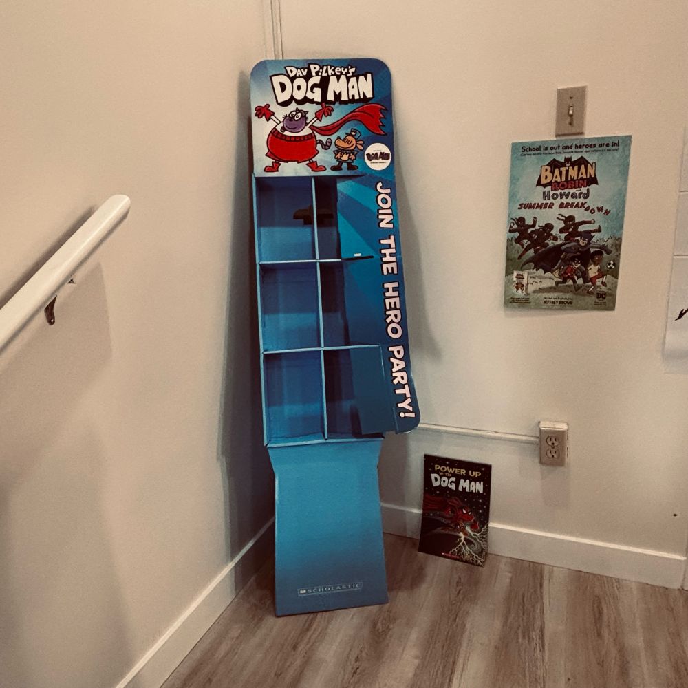 Picture of our empty dog man display just waiting to be filled with copies of the newest addition of dog man this Tuesday
