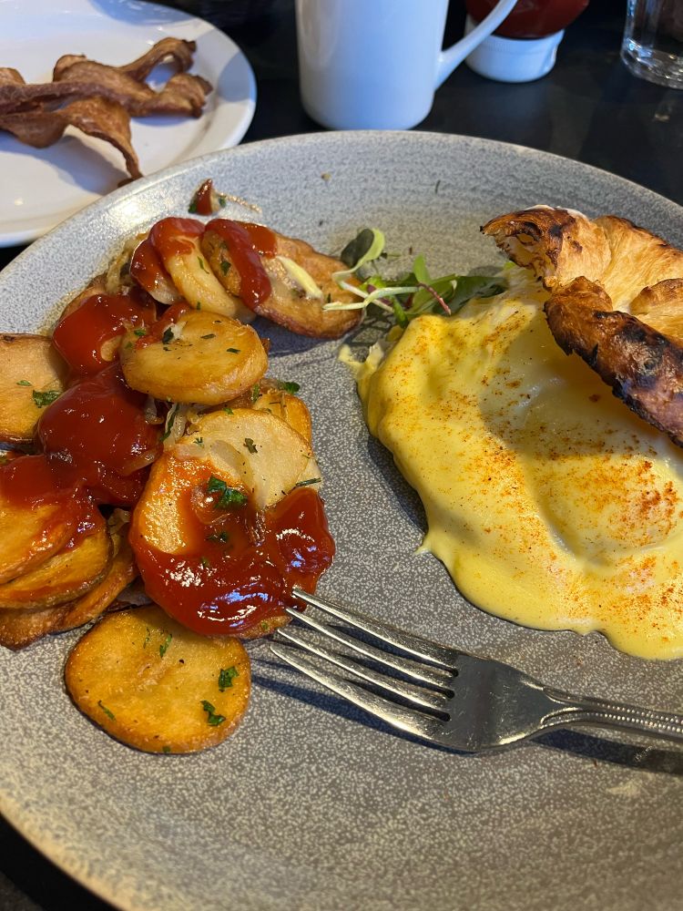 A picture of Smoked Salmon Benny with Lyonnaise style potatoes from Eggspectation at Complexe Desjardins in Montreal