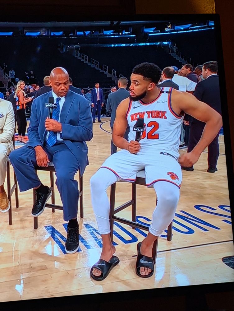 Charles Barkley checking on Karl Anthony Towns's feet