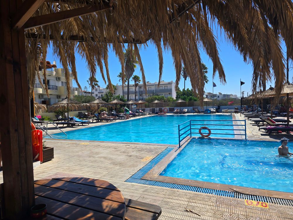 2 swimming pools, one for kids and one for grown ups. All surrounded by palm trees and sunbeds