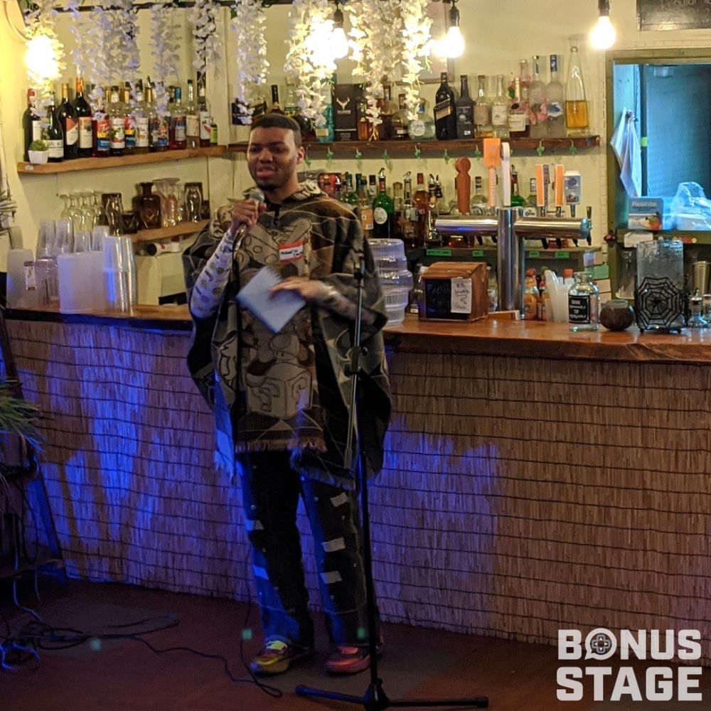 Photo of Michael speaking at bonus stage