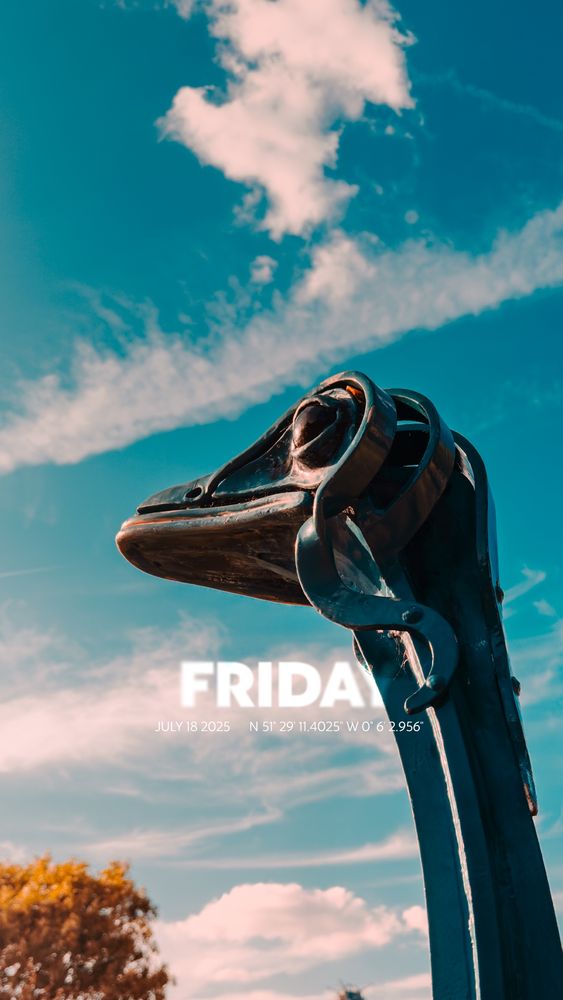Friday July 18 2025
A metal statue of an ostrich stands against a summer sky