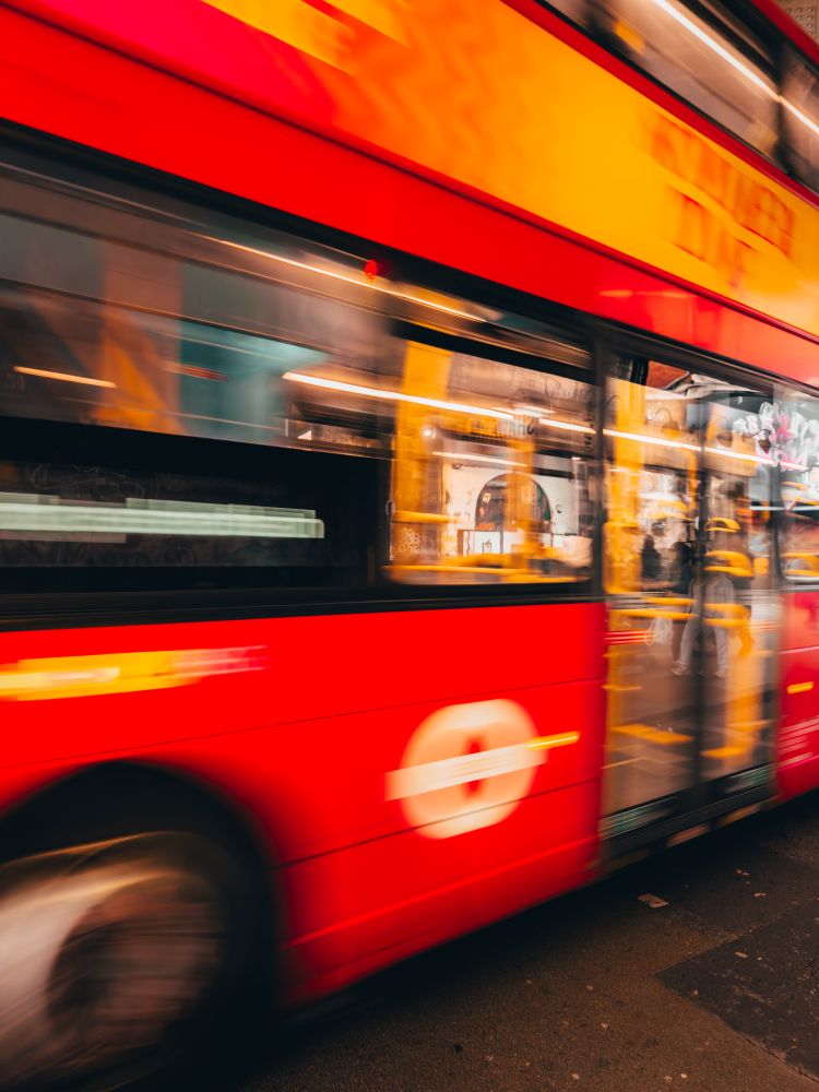 A bus is blurred as it screams by