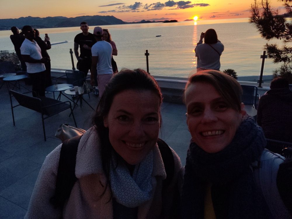 Ruth and me on the terrace of the hotel in Dubrovnik, sun going down into the ocean behind us