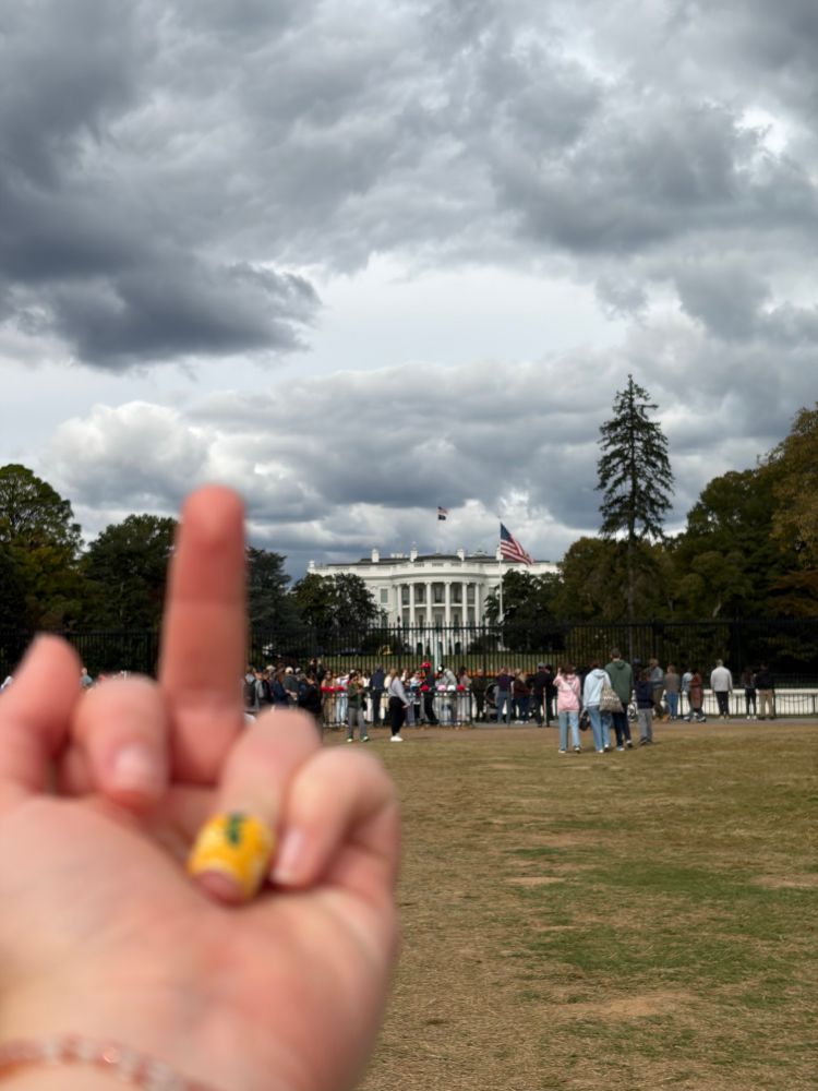 Jori’s hand flipping off the White House