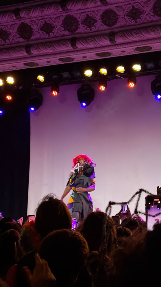 Kori King and Lydia Collins kissing on stage