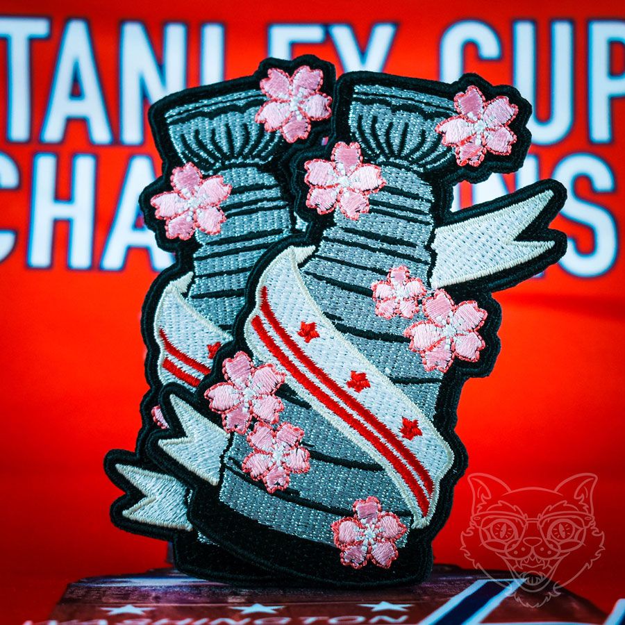 Embroidered patch of the Stanley Cup with the DC flag and cherry blossoms