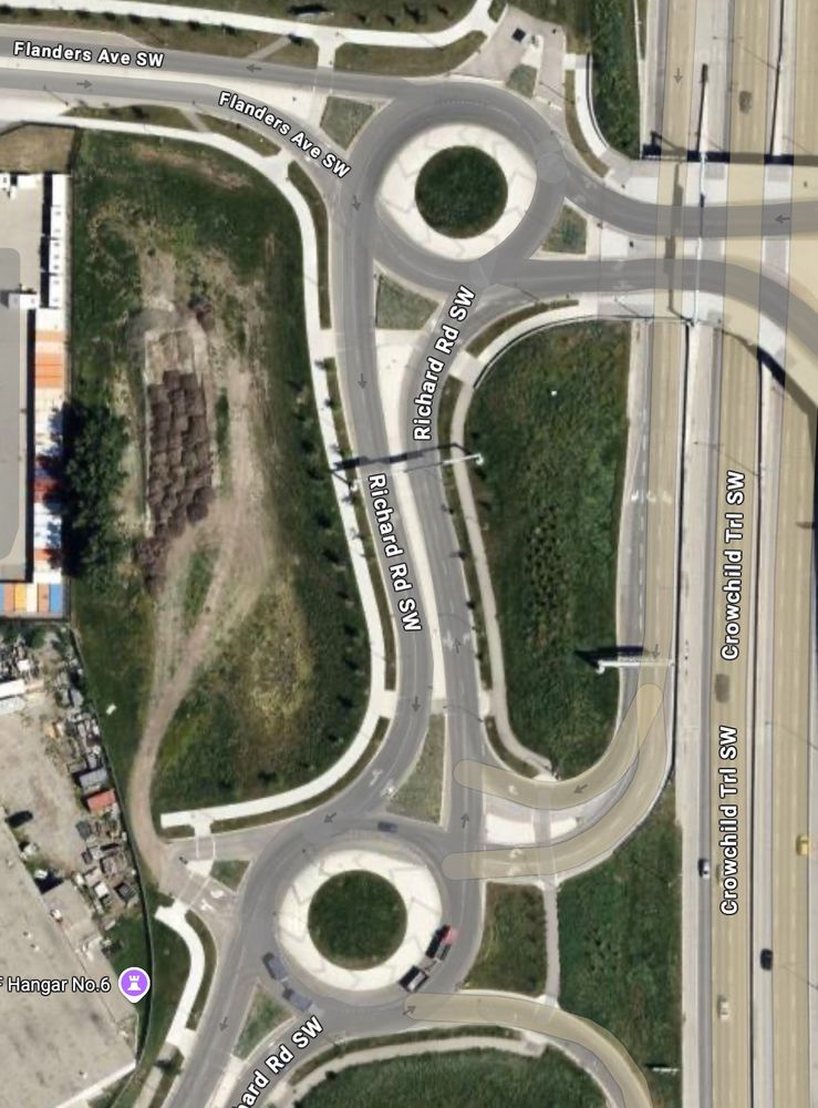 Google Maps view of dual traffic circles at Flanders Ave and Richard Rd SW, next to Crowchild Trail. 