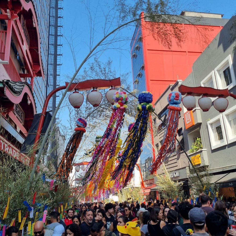 A street with Japanese red lamps and paper decoration for Tanabata