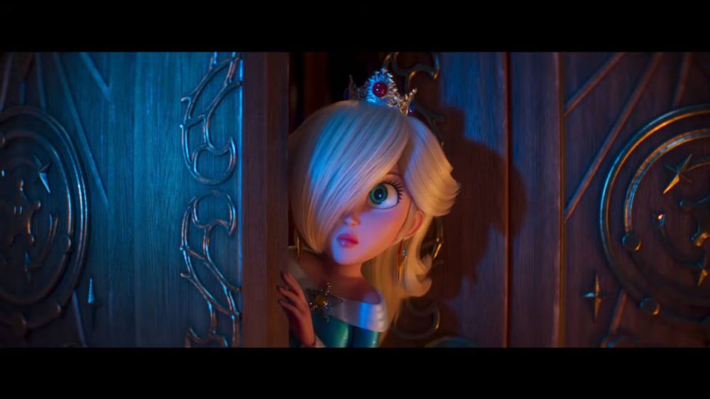 Fotograma del tráiler de la peli de Super Mario Galaxy con Estela asomándose por una puerta. 