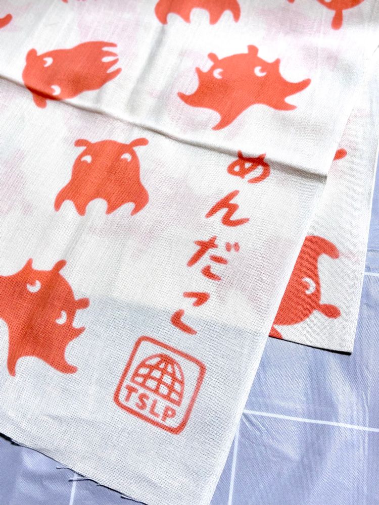 メンダコ柄手ぬぐい（端のロゴ部）