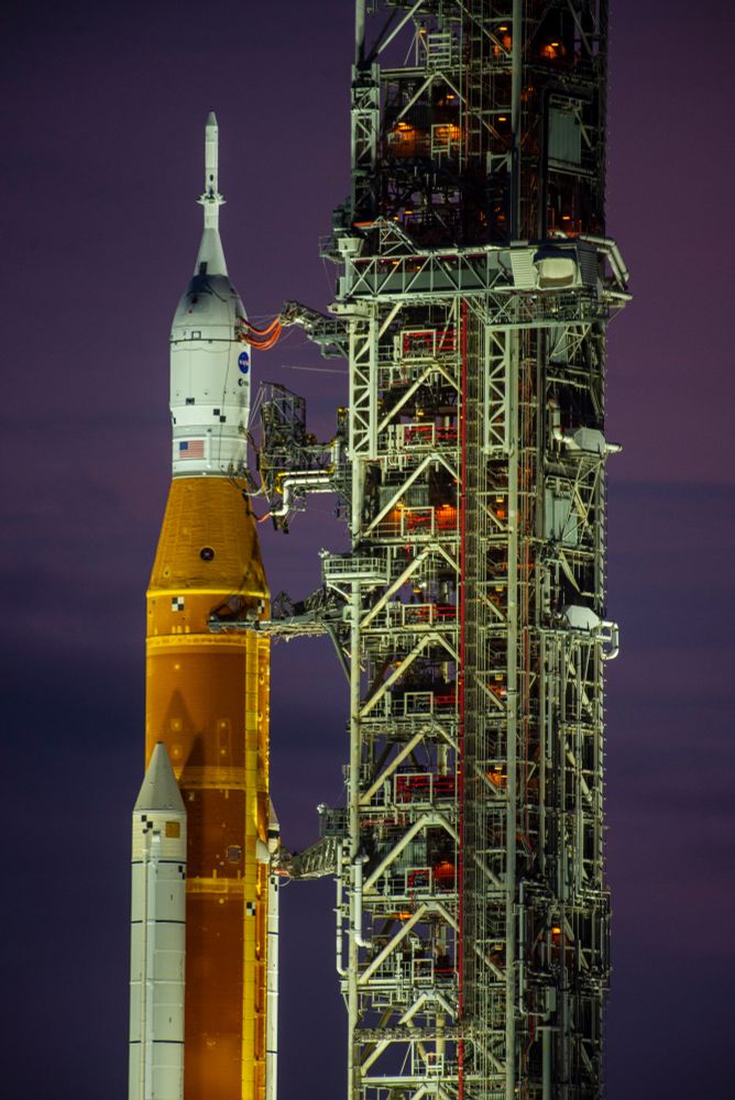 SLS rocket on the pad at KSC in Florida at dusk. 