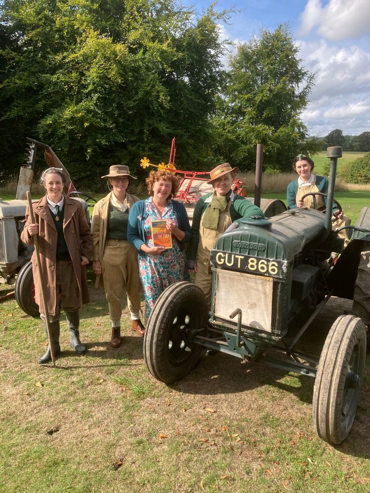 Me in my fave repro 40s dress & cardi with some of the lovely Land Girls, & their gorgeous, camouflage-green Fordson tractor, bringing history, camaraderie & hard work to life, to farm & feed people & fight fascism! 