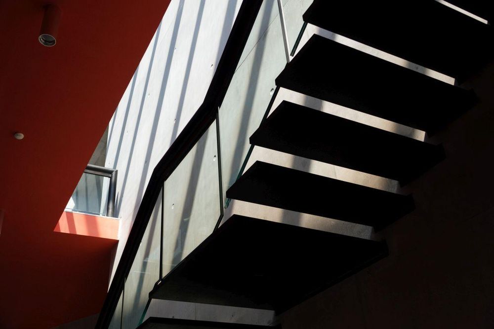 shadows in the staircase of a gallery
