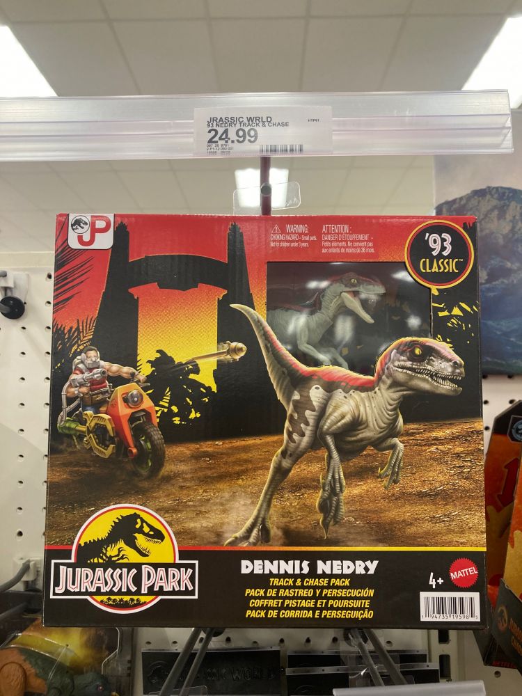 Jurassic park toy. Cyborg looking man on motorbike that is supposedly Dennis Nedry is firing a gun at a raptor. 