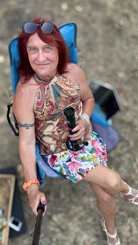 Selfie in the yard with bong, cute floral outfit