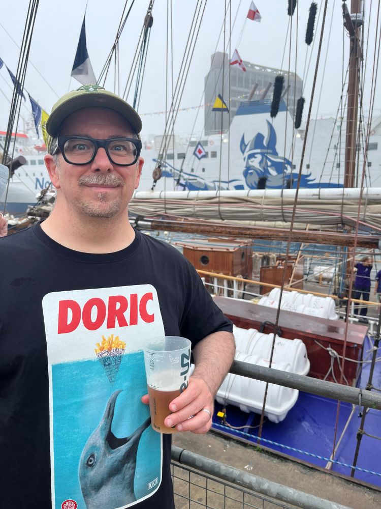 Me in my Doric Studio t-shirt with the North Link ferry in the Aberdeen harbour. Pint of Tennent’s. 
