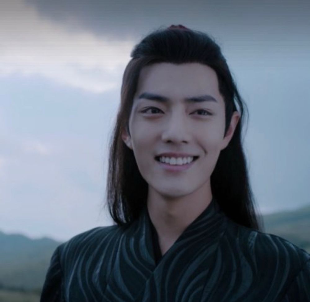 Xiao Zhan as Wei Wuxian smiling in the finale scene of The Untamed.